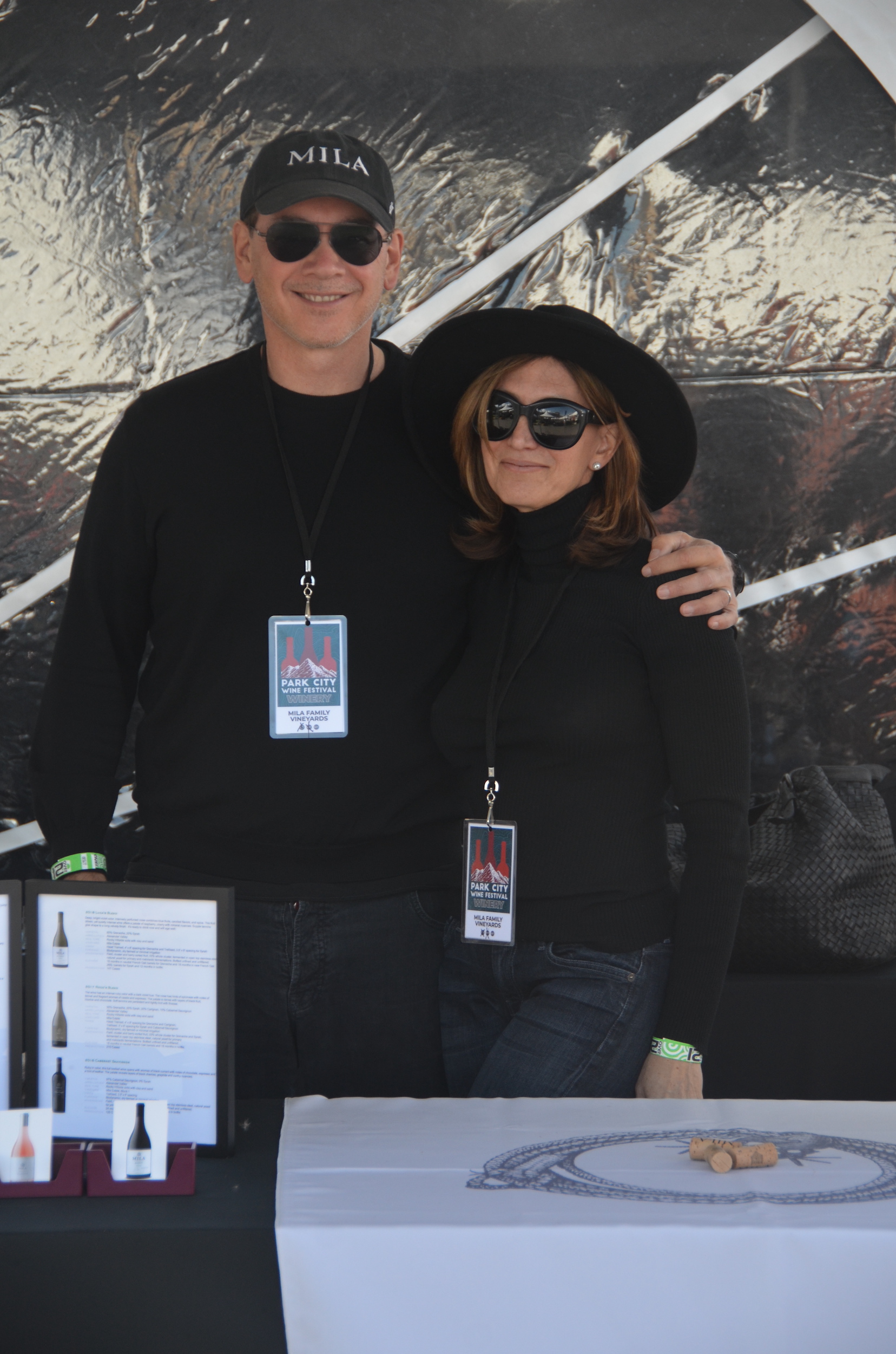 Michael & Loretta in sunglasses pouring wine in Park City
