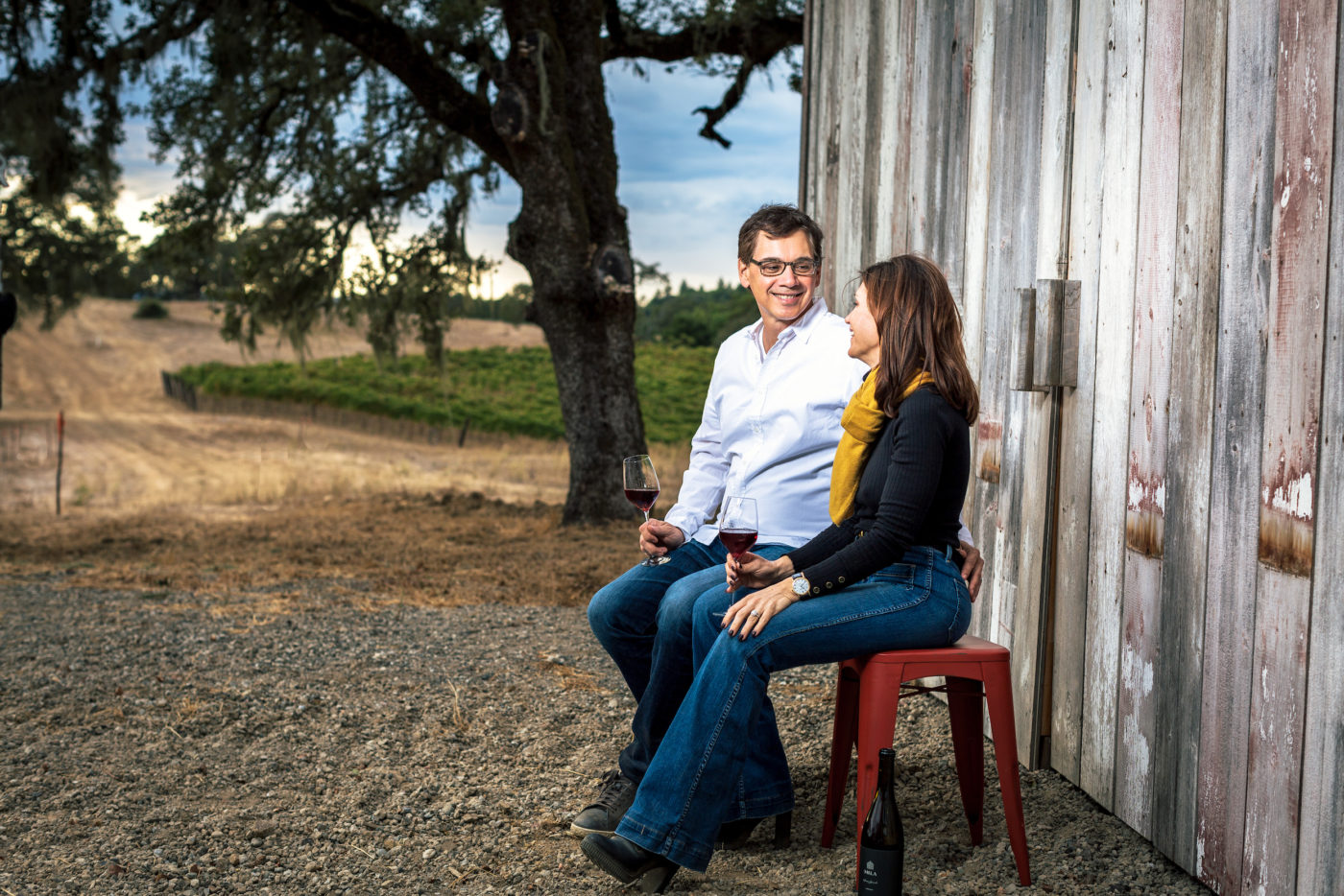 Michael and Loretta sitting next to their barn